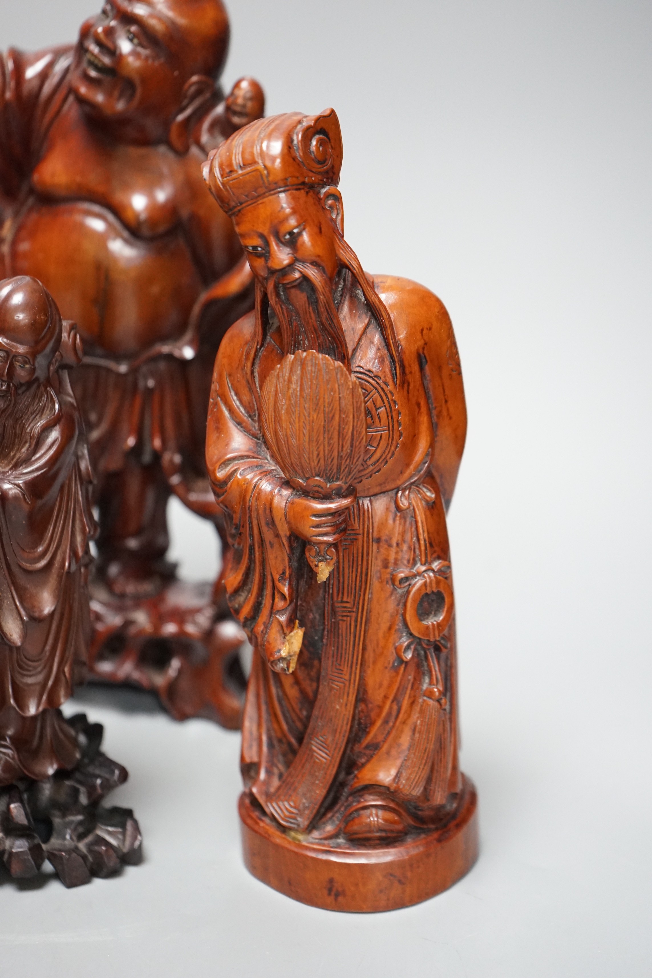 Two Chinese champlevé enamel vases, a soapstone carving and three early 20th century Chinese carved hardwood figures, tallest 26cm